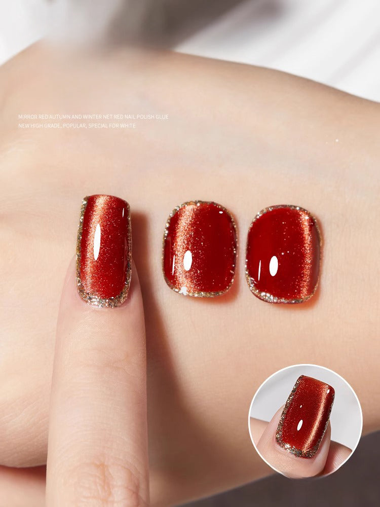 Cat eye gel polish 11 for elegant and luxurious nail designs with a bold red cat eye effect that captures the light