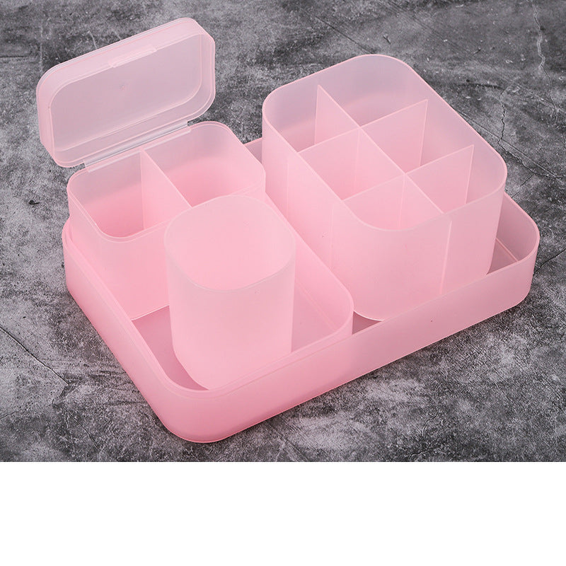 A versatile nail storage box made of translucent pink plastic, featuring multiple compartments of varying sizes. The box has a lid that opens to reveal four large sections and several smaller divided sections, perfect for organizing nail art supplies, tools, and accessories. The compact and functional design makes it an ideal choice for keeping nail essentials neatly organized and easily accessible.