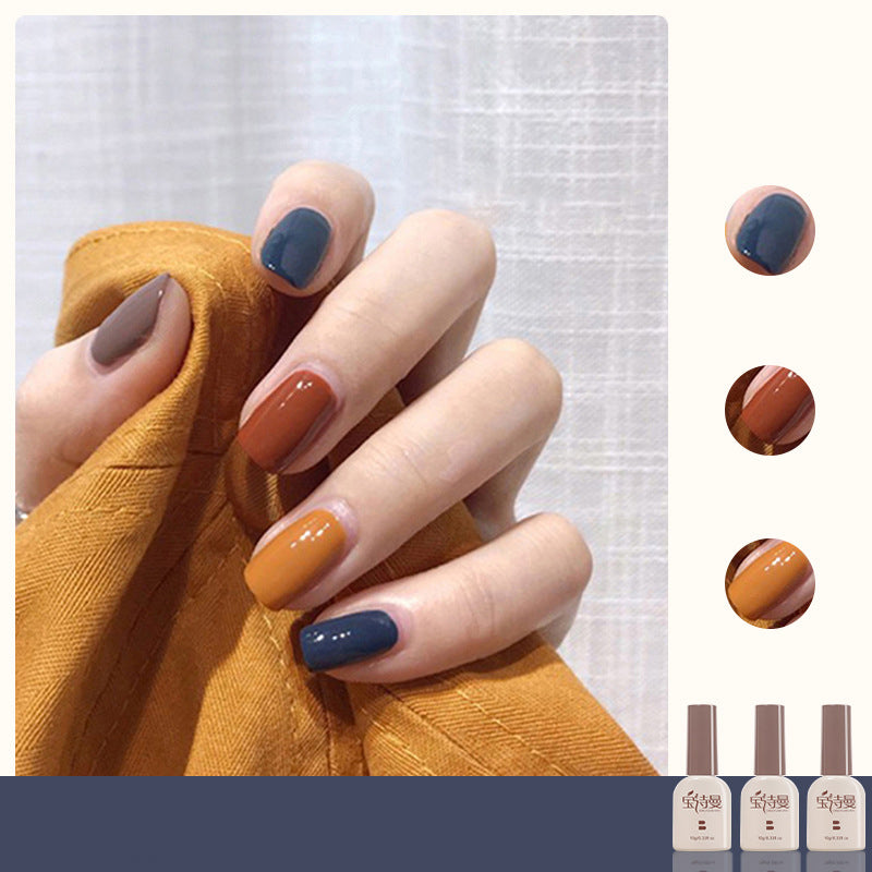 Caramel Color + Withered Yellow + Enchanting Blue cat eye gel polish for bold and striking nail art with a caramel color base, accented by withered yellow and enchanting blue for a dramatic and eye-catching look