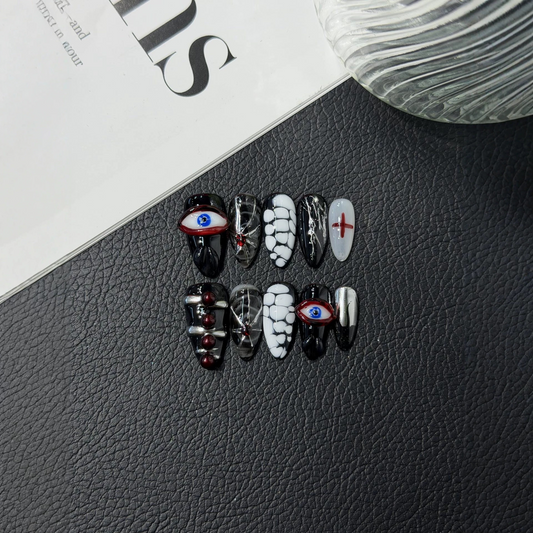 Gothic almond press-on nail set with eye motifs, red crosses and silver-tone accents