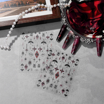 Gothic Halloween nail stickers displayed with red and black nail art and dark red roses