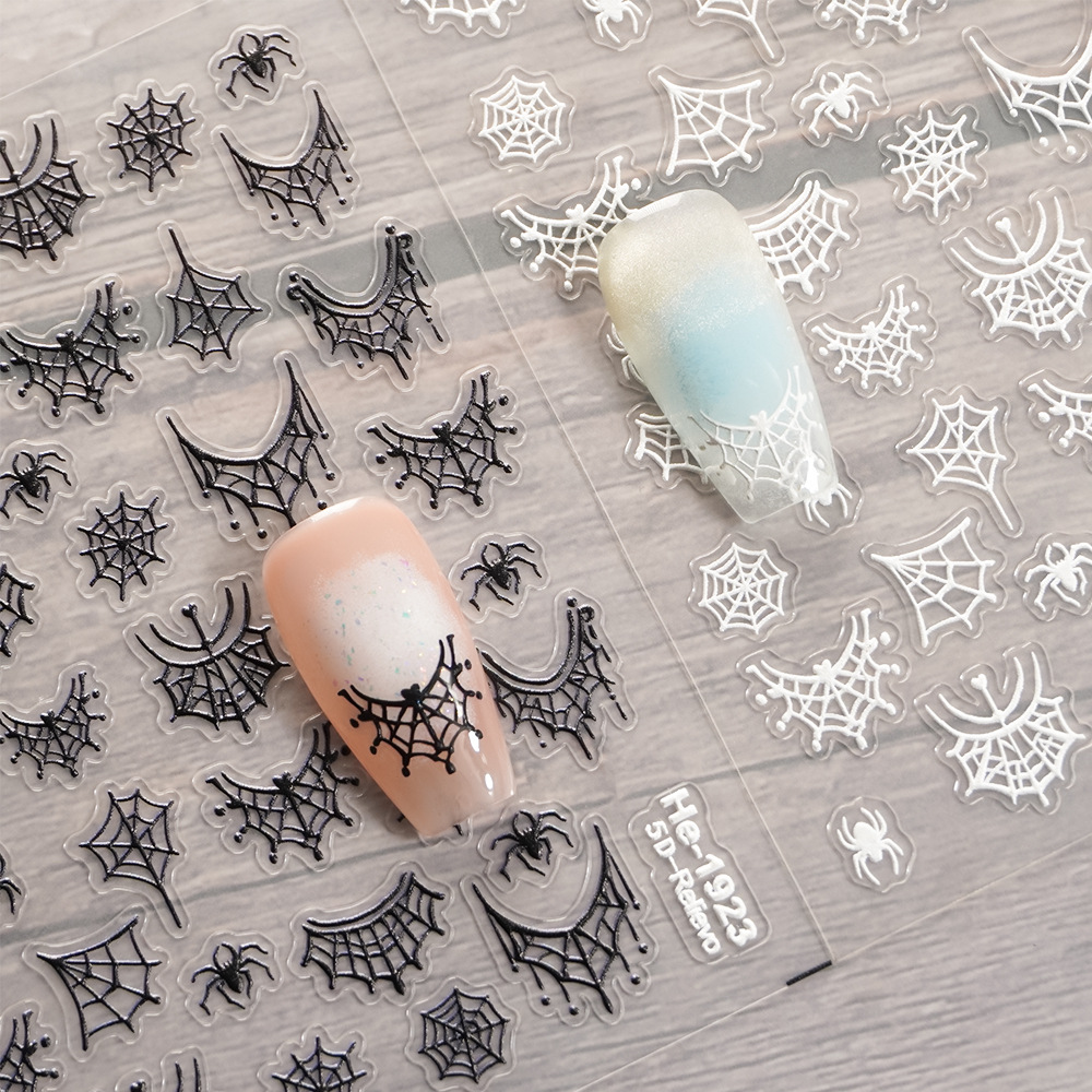 Redanco black and white embossed spider and spider web nail stickers with manicure examples