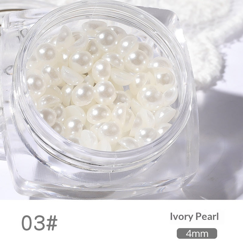 Close-up of 4 mm resin pearl nail art decorations in a square jar