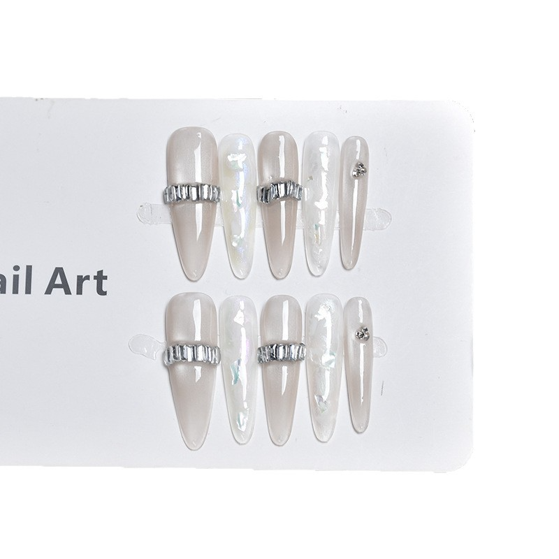 Isolated display of the SG747 shell and silver band press-on nail set