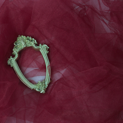 Red sheer tulle photography backdrop with a decorative frame
