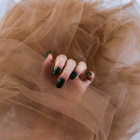 Brown sheer tulle backdrop styled for nail photography