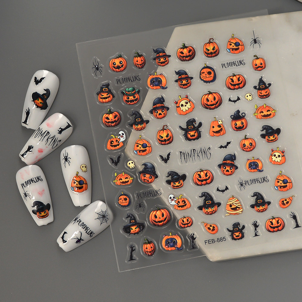 FEB-885 pumpkin Halloween nail sticker sheet and manicure examples on a dark background
