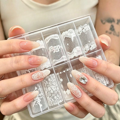 White lace nail transfer foil set held beside a nude almond manicure with lace accents