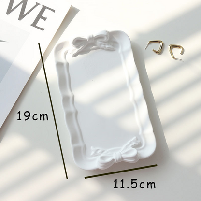 Rectangle white bow plaster tray measuring approximately 19 by 11.5 centimetres